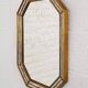 Octagonal mirror in Venetian style with gold-rimmed parecloses