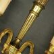 Pair of wall sconces in the Louis XVI quiver style in gilded bronze.