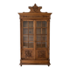 Antique wooden library with a carved pediment.