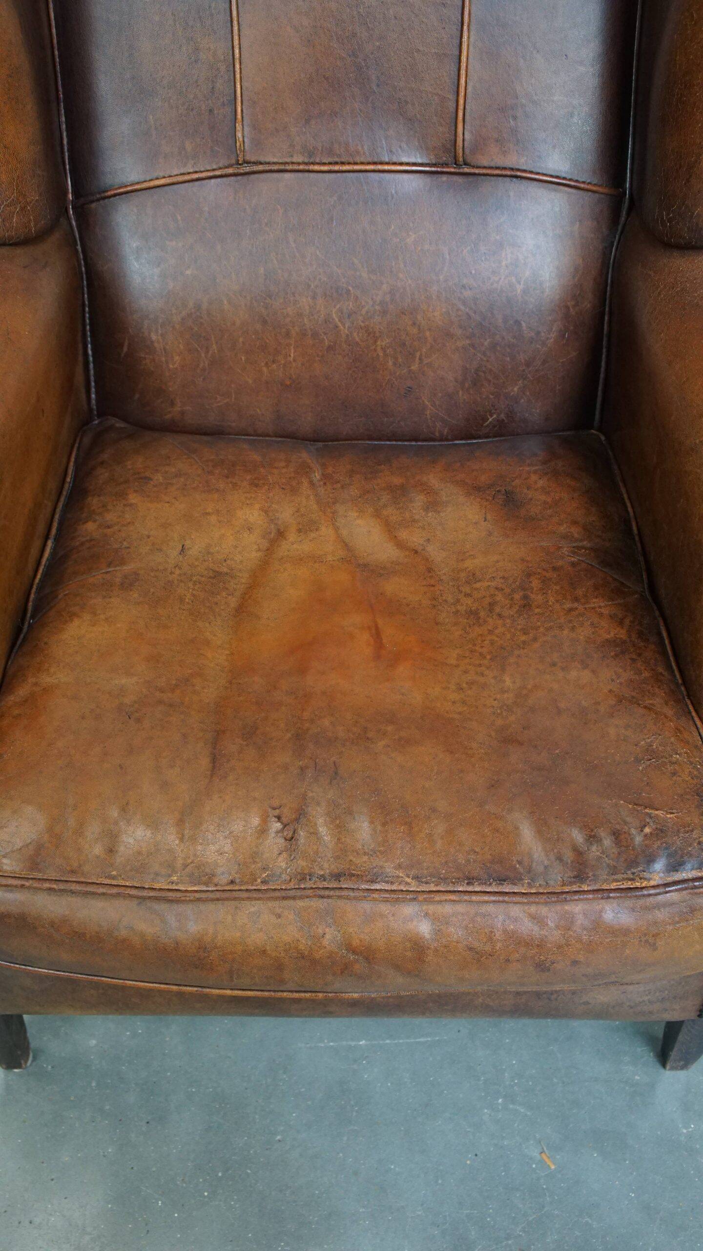 Sheepskin wingback chair in good condition