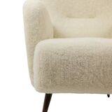 Armchair, or bergère, with its boucle fabric. 1950s