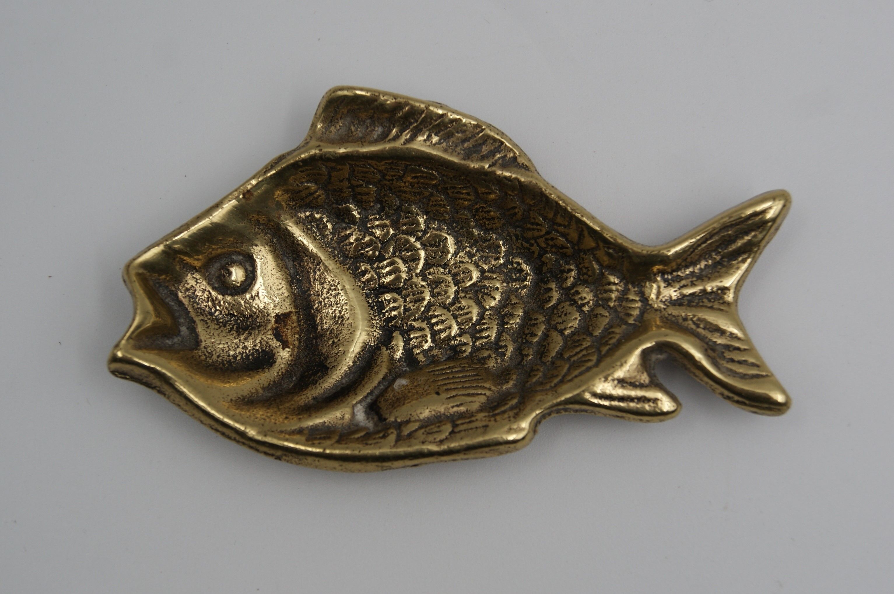 Empty bag brass fish England