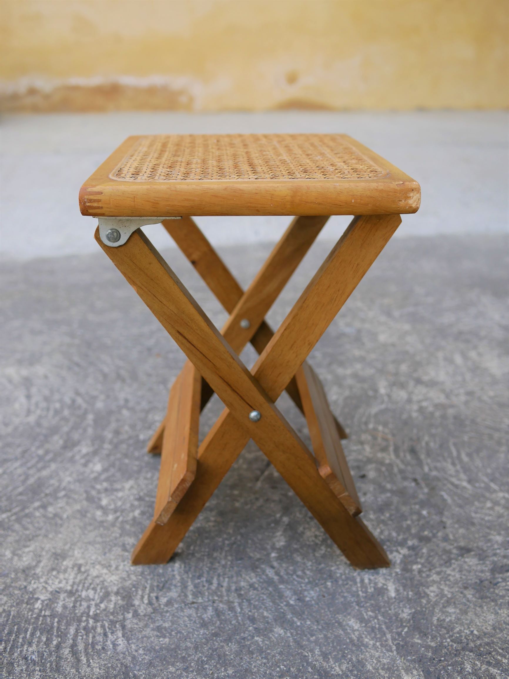 Wooden stool and folding caning