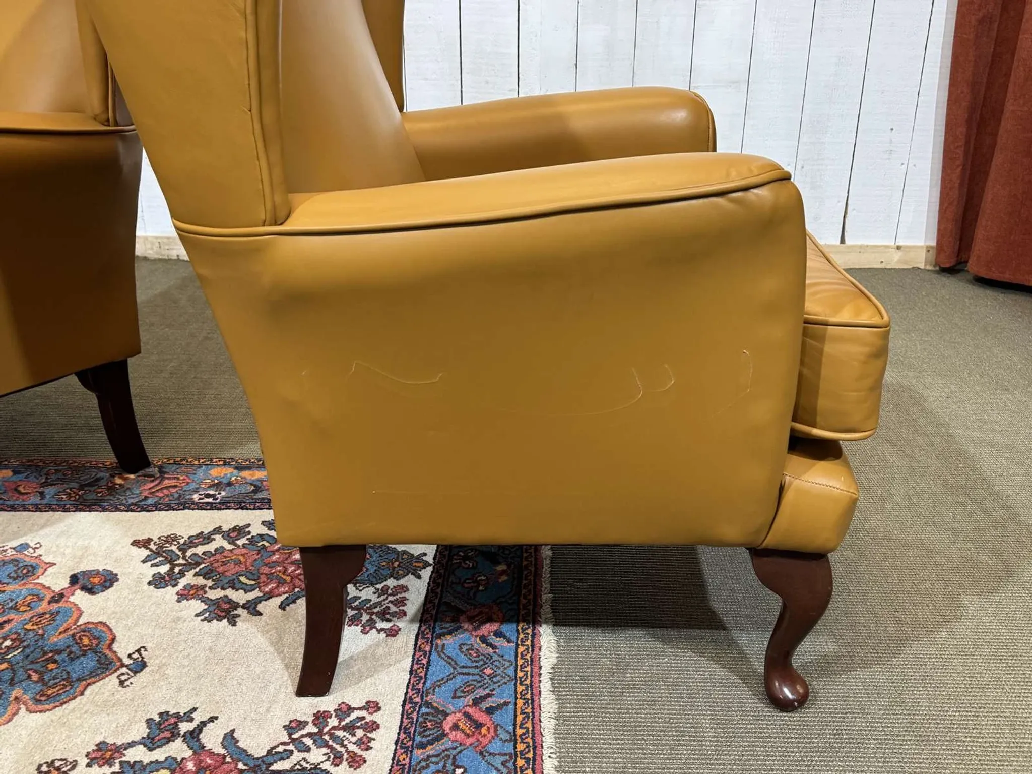 Pair of 1980s English wingback armchairs in leather.