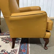 Pair of 1980s English wingback armchairs in leather.