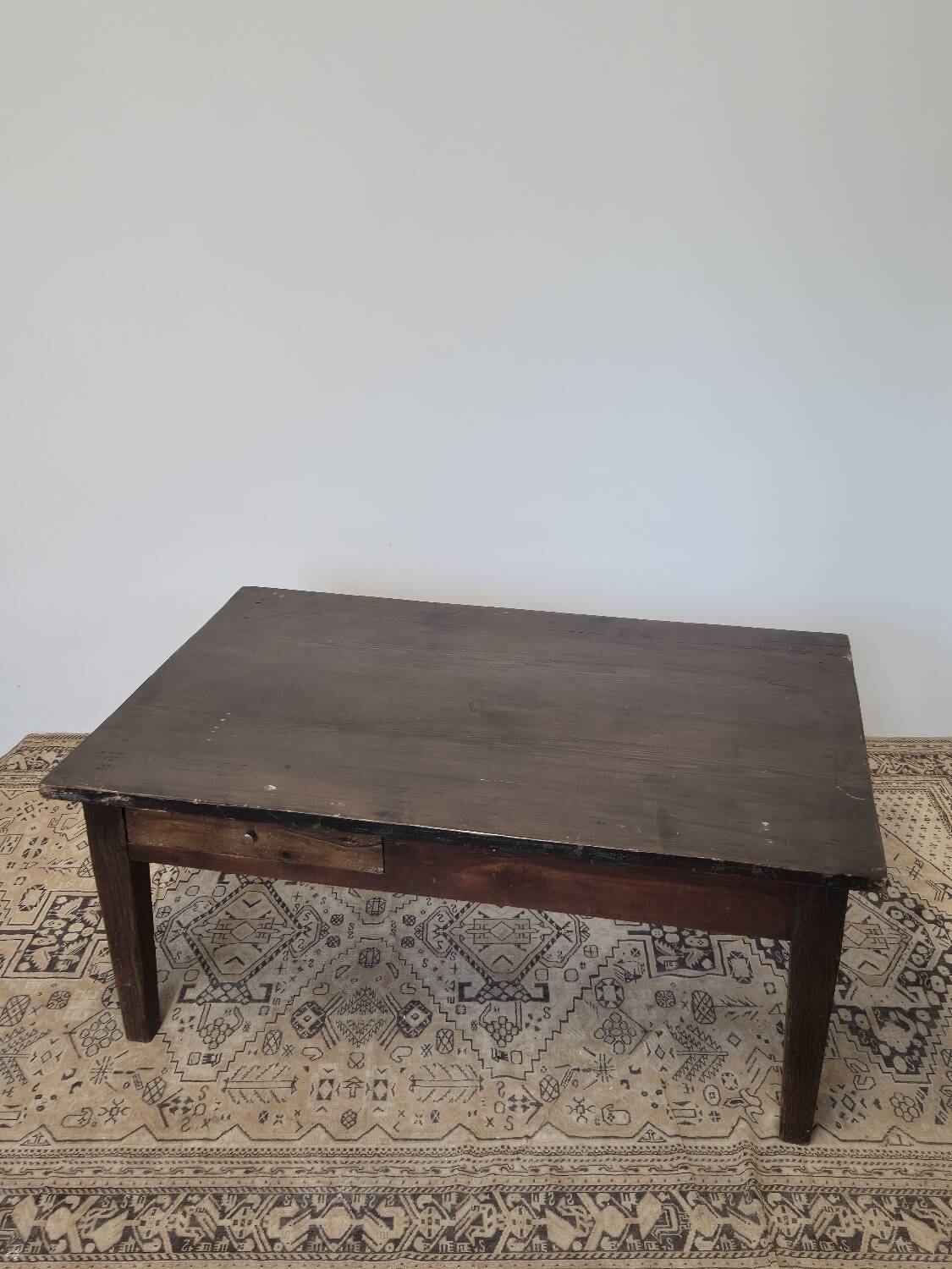 Rustic farmhouse coffee table from the 1900s with two drawers.