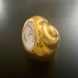 2 Snail-shaped salt pots in gold-colored porcelain