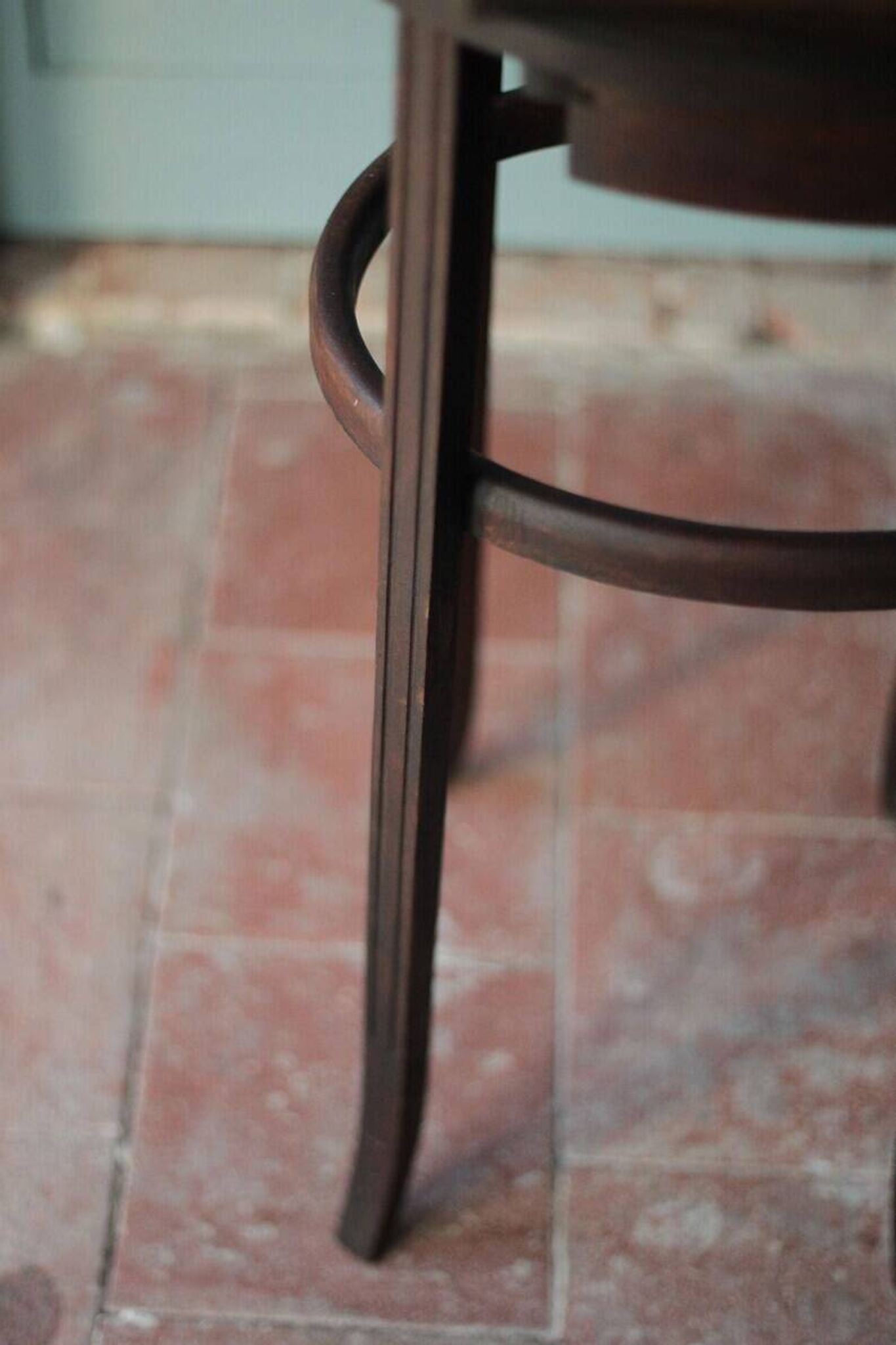 Wooden drawer table or 19th-century work table with a curved wooden stretcher, in the style of Thonet, circa 1900-1920.