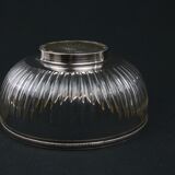 Crystal cup surrounded by two silver friezes