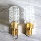 Pair of vintage wall sconces in gilded brass with moulded glass.