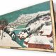 Antique chest hand-painted with a snowy village scene and a starry interior.
