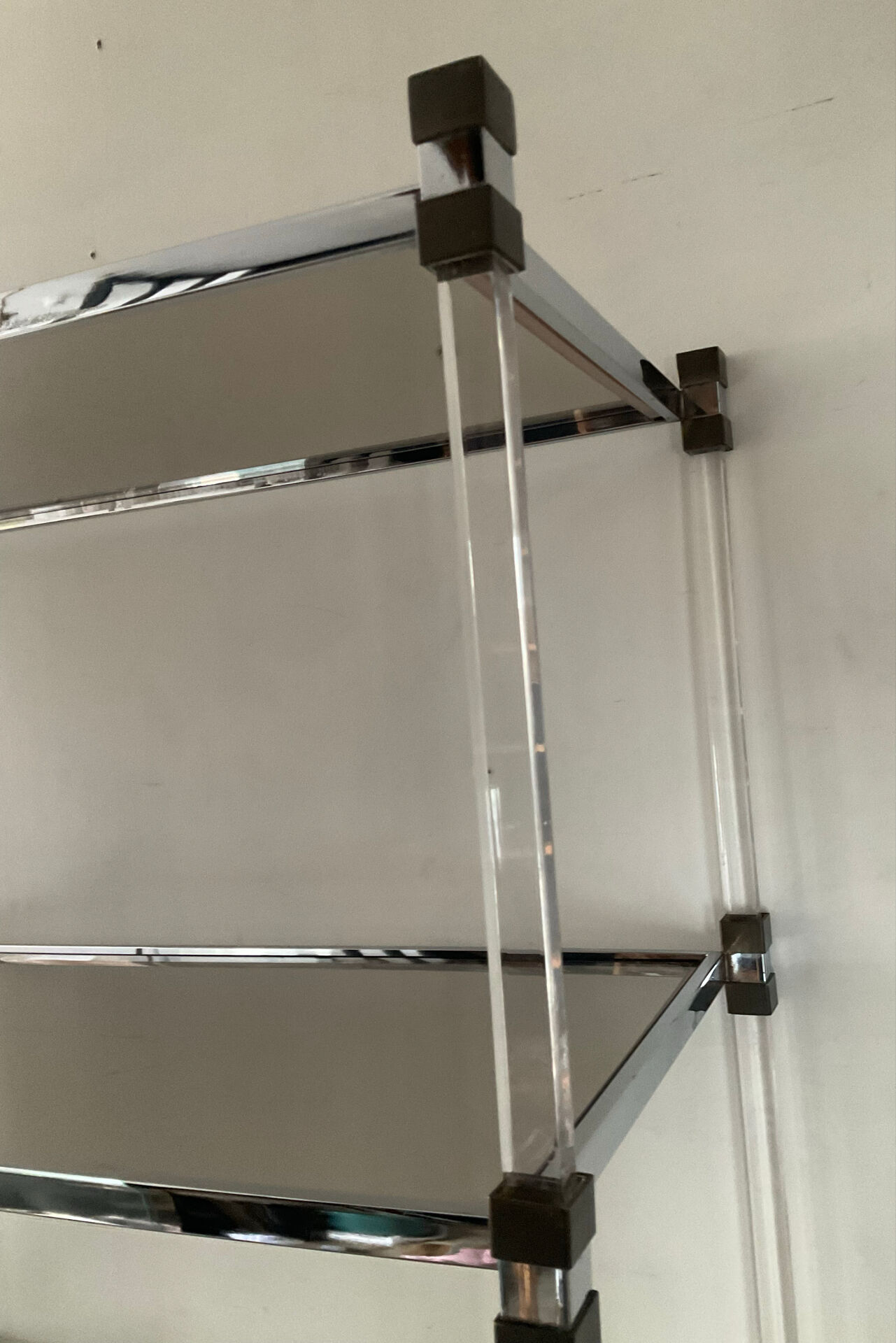 Vintage shelf in lucite, brass, and smoked glass from the 1970s.
