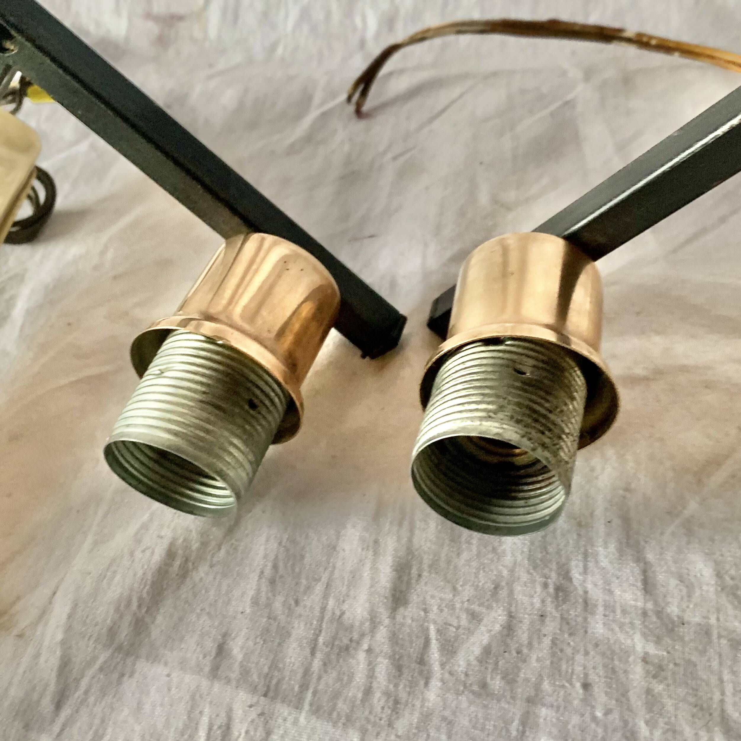 Pair of wall sconces in gilded brass and textured glass