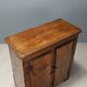 Antique pine wardrobe painted in walnut stain, restorations, Italy, 17th century.
