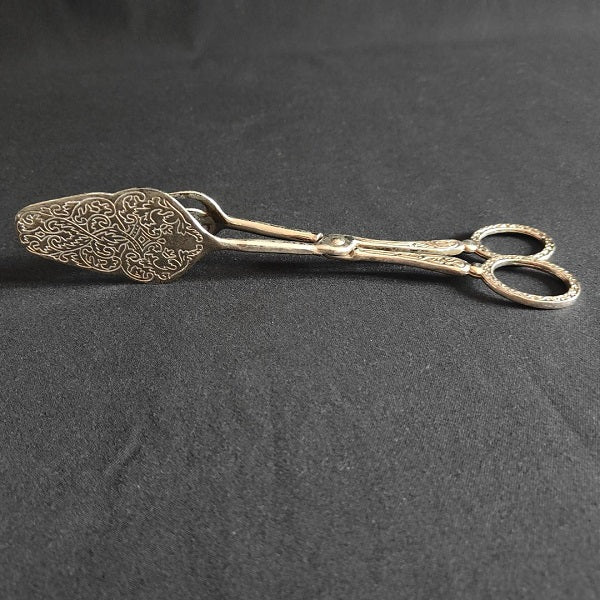 Engraved metal cake pliers