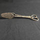 Engraved metal cake pliers