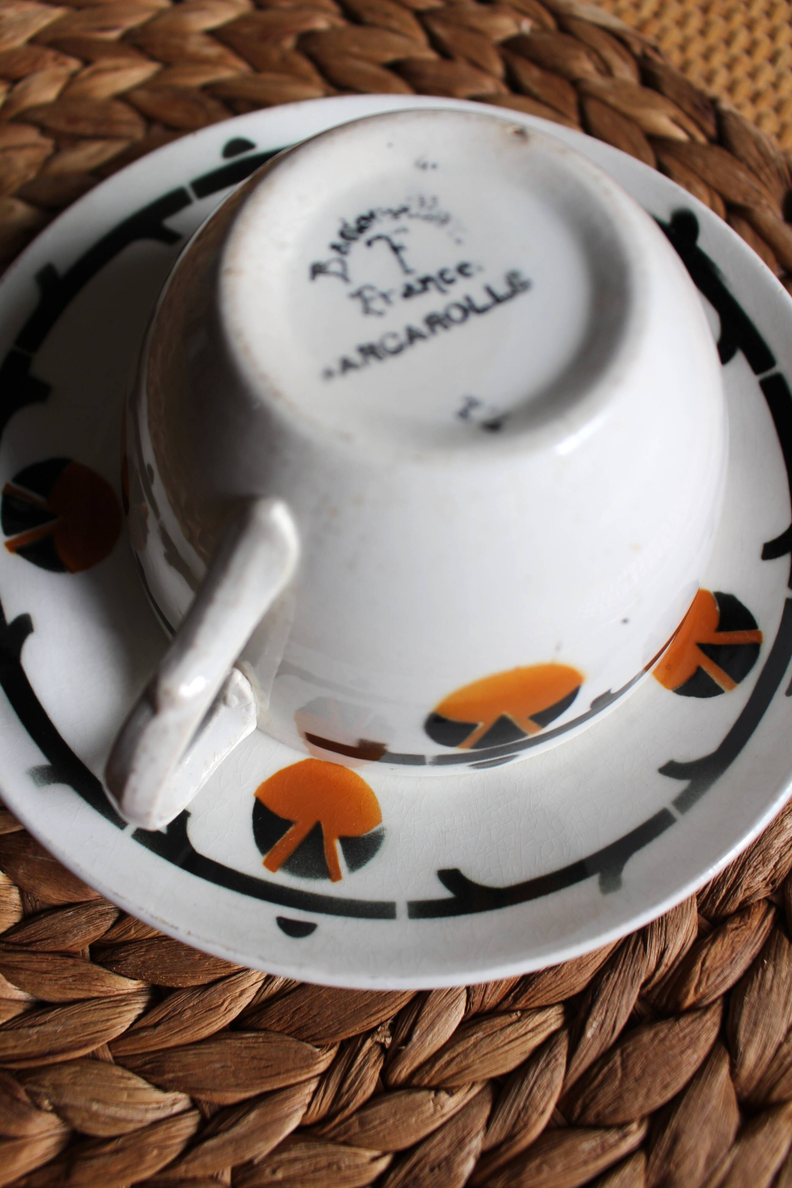 A large cup of chocolate tea, saucer Badonviller Barcarolle orange black.