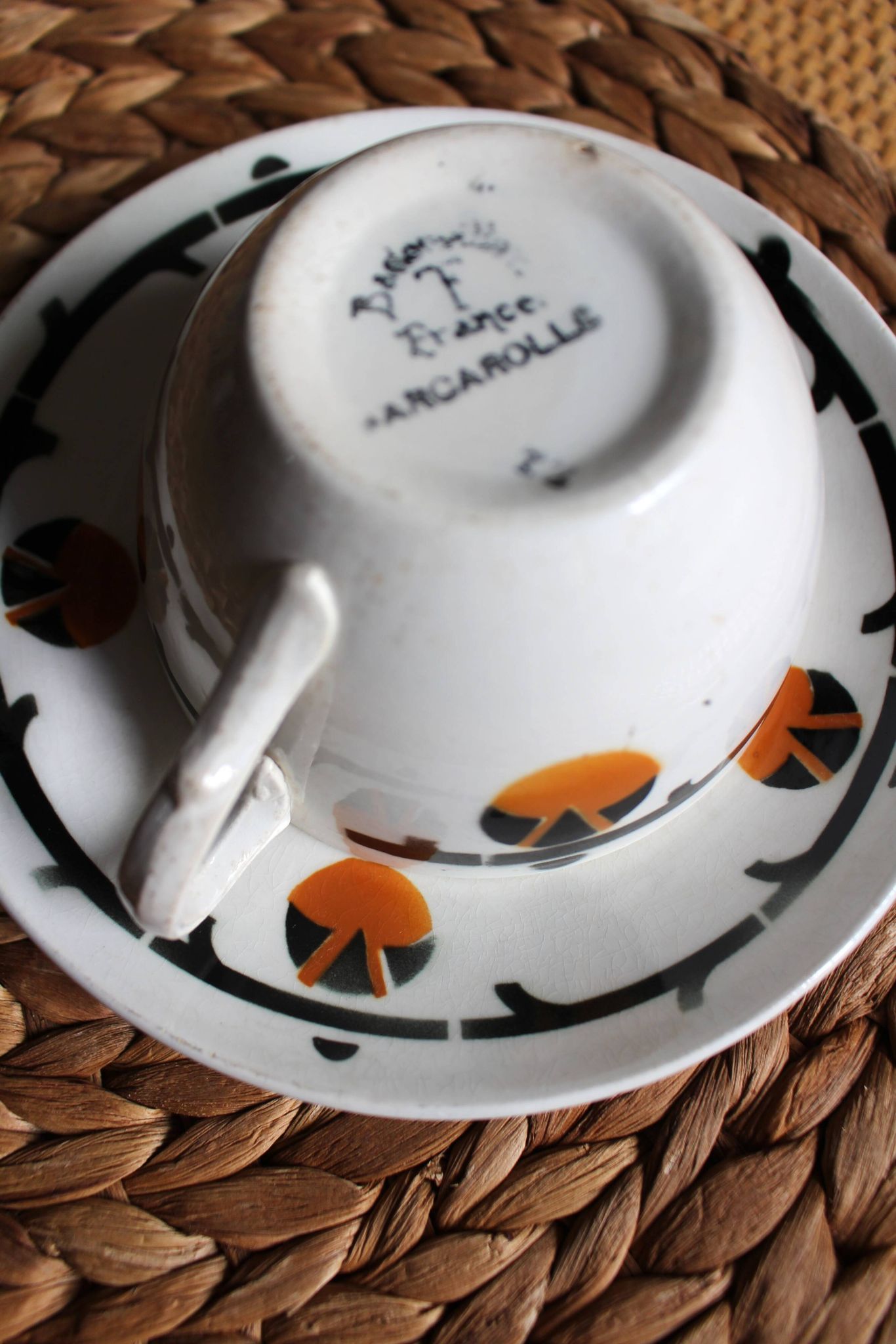 A large cup of chocolate tea, saucer Badonviller Barcarolle orange black.
