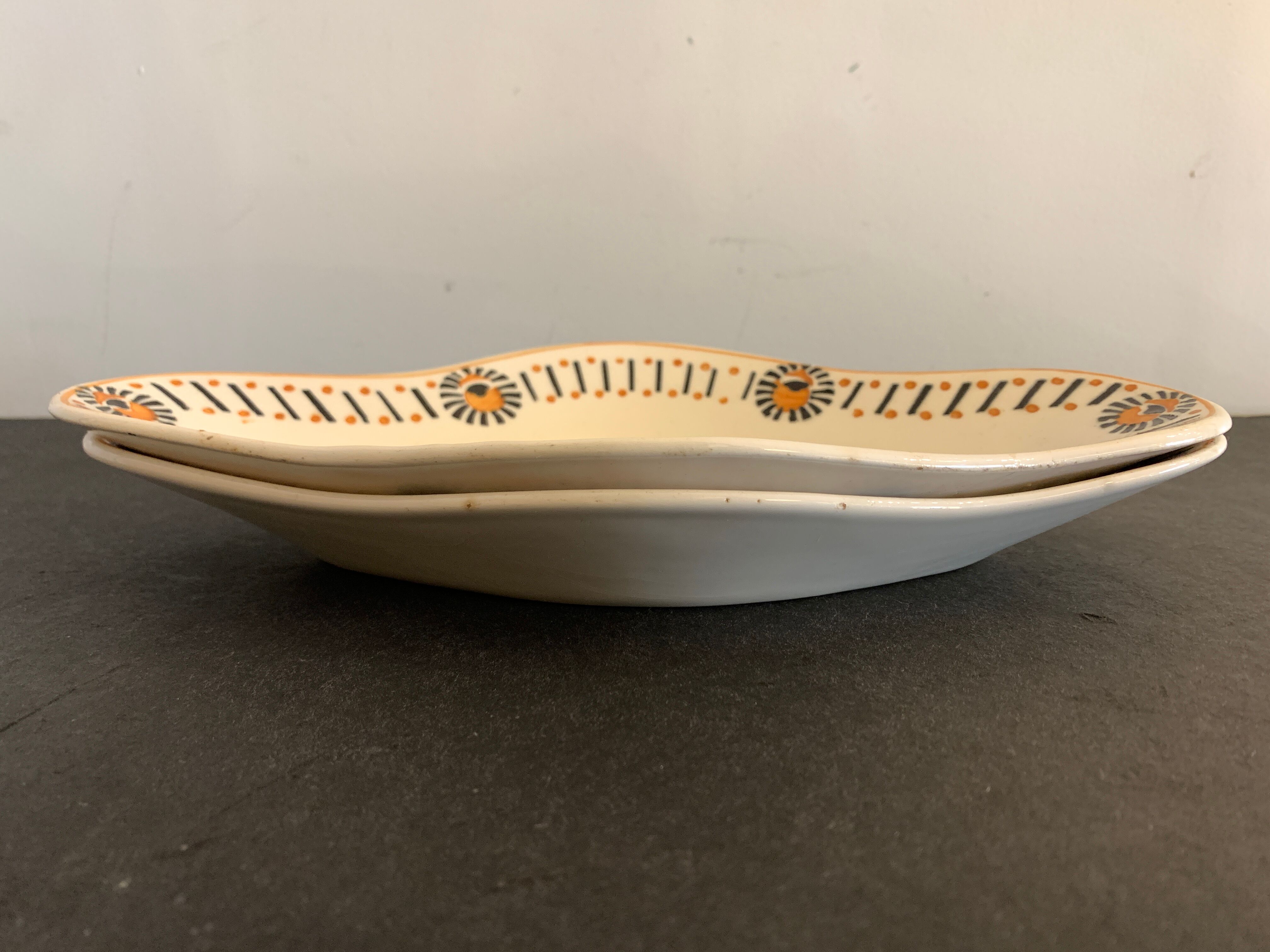 Pair of art deco raviers signed Longwy and numbered, model Gerazine