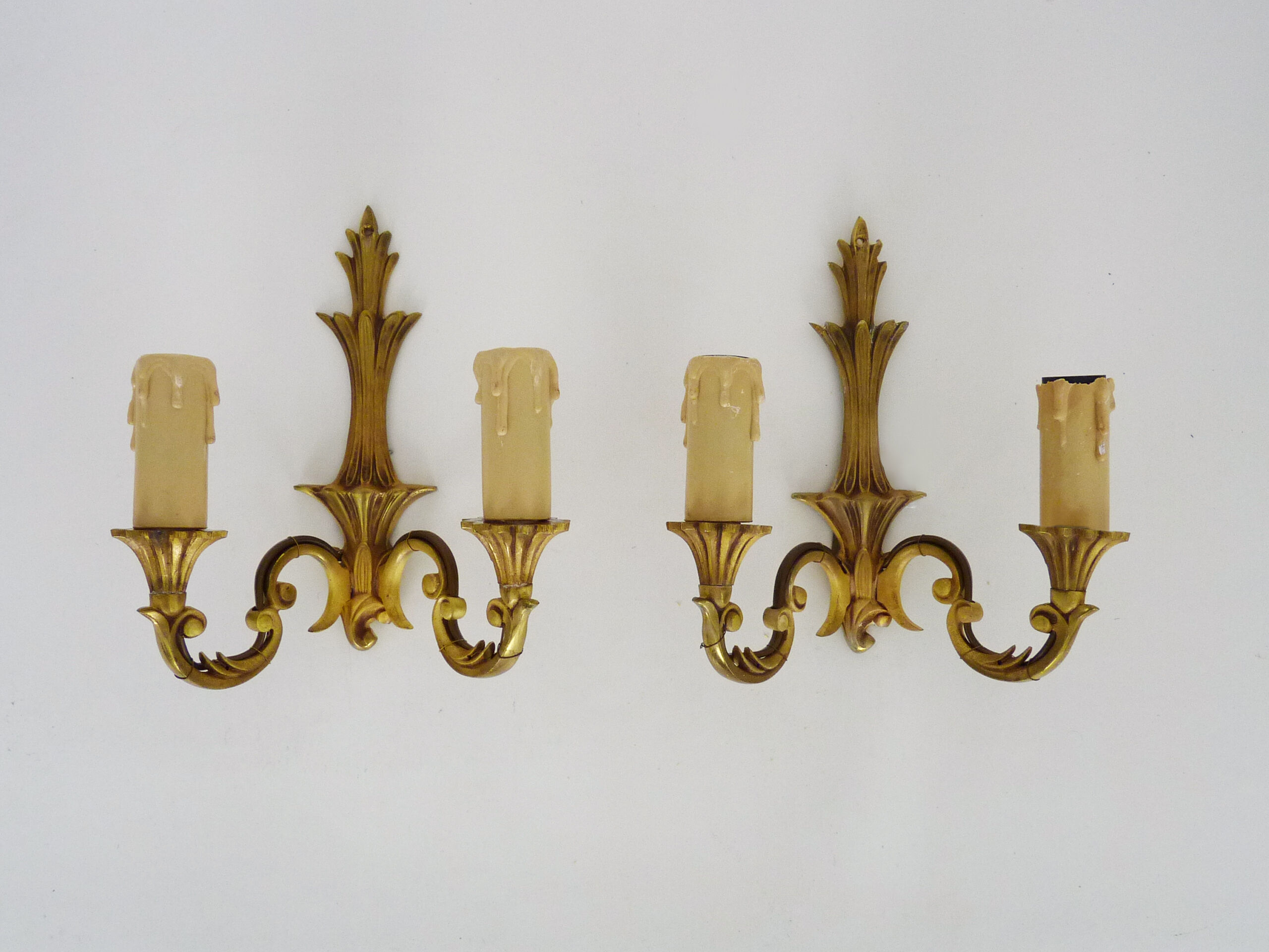 Old pair of wall sconces with double fires in bronze, seventies