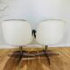 2 office chairs attr. to Strafor, white molded plastic shell, blue skai and chrome metal star base