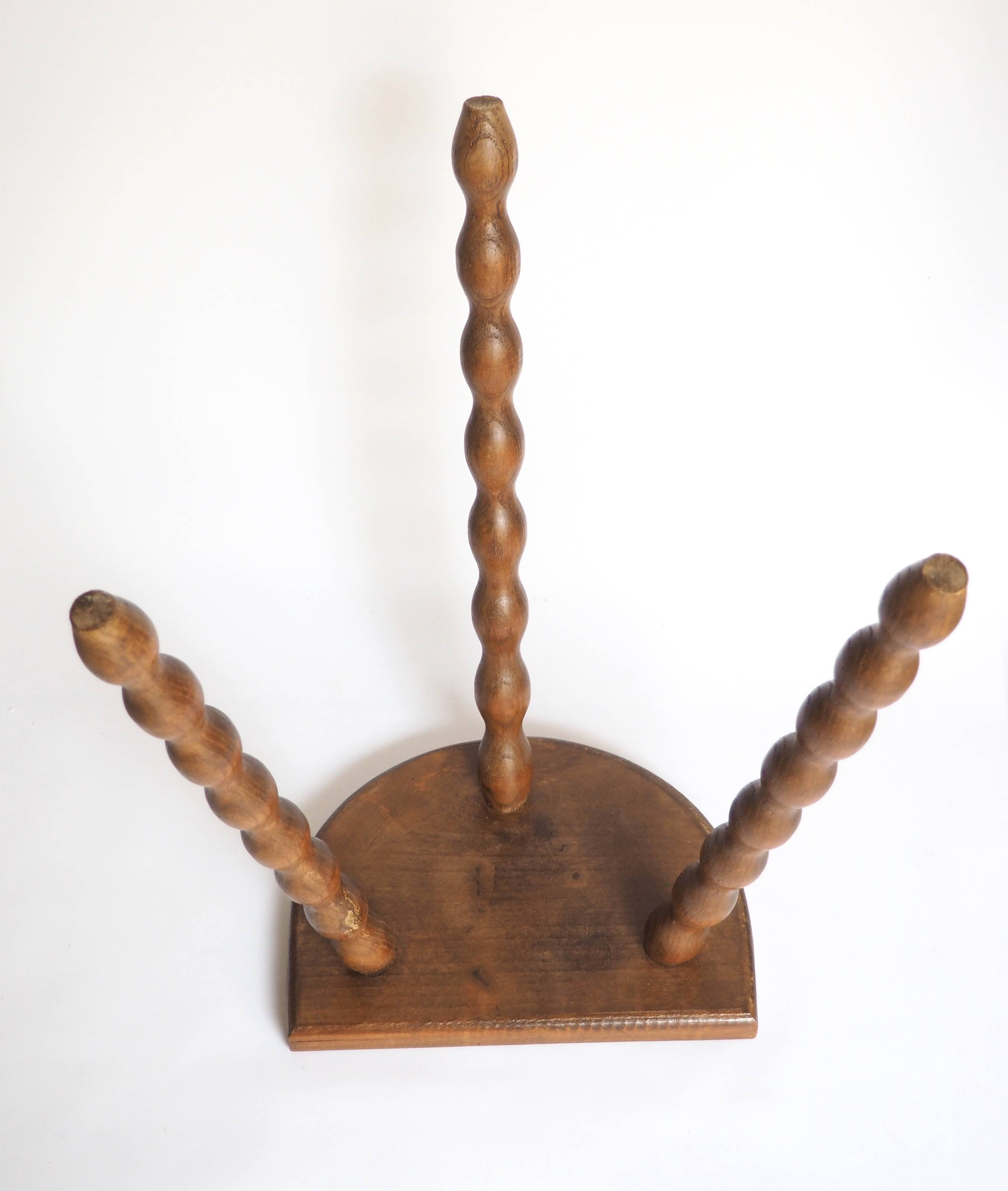 High tripod stool in turned wood