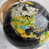French mid-century school globe with black oceans on printed paper, cream plastic base