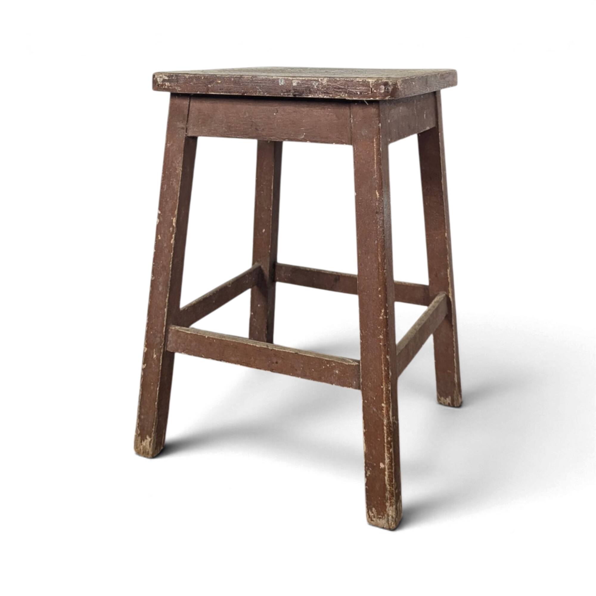 Brown painted wooden workshop stool with a patinated top.