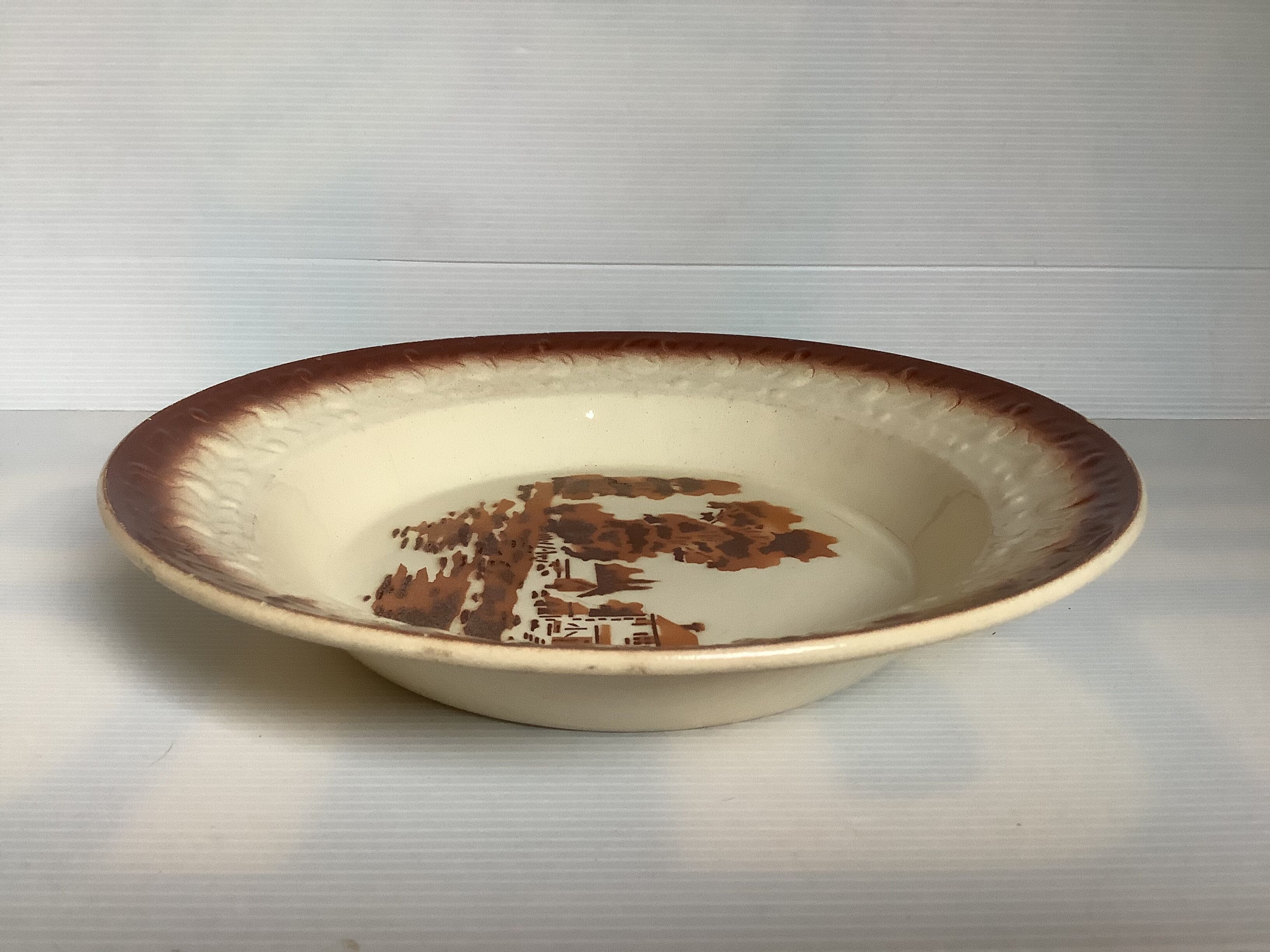 Earthenware plate from Moulin des Loups with stencil pattern.