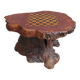 Brutalist chessboard coffee table made from tree stump.