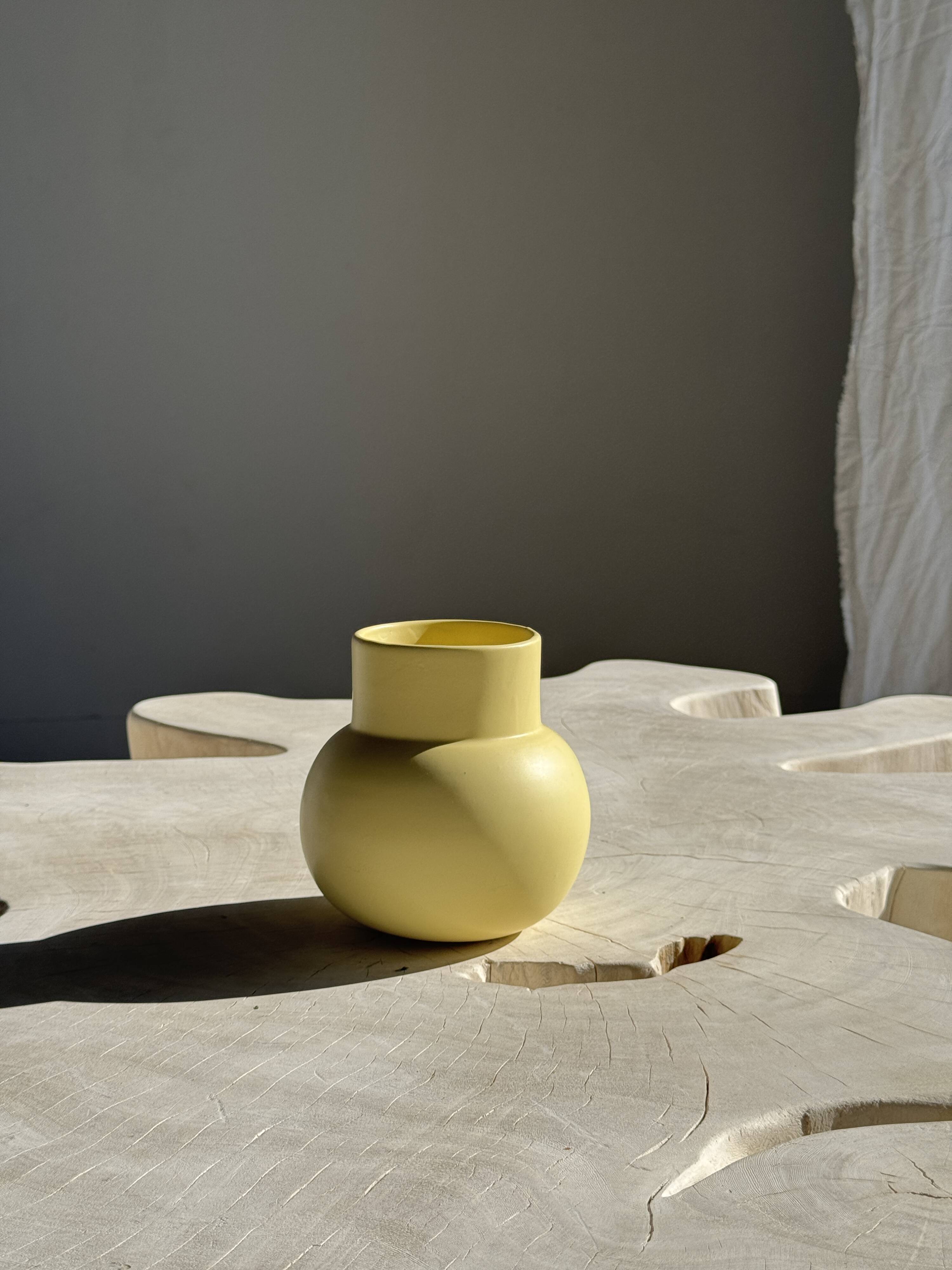 Small light yellow ball vase