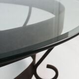 Rustic round coffee table with wrought iron base and glass top, France, 1930s