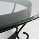 Rustic round coffee table with wrought iron base and glass top, France, 1930s