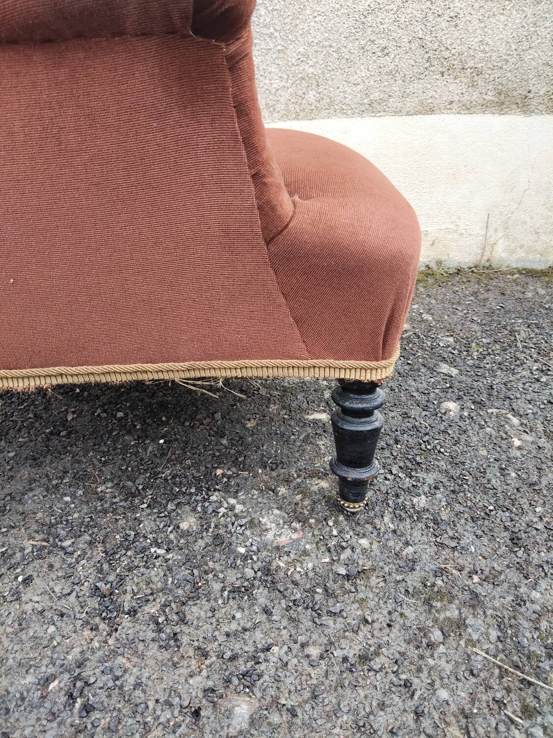 Antique brown velvet tub chair – turned legs and brass rings.