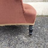 Antique brown velvet tub chair – turned legs and brass rings.