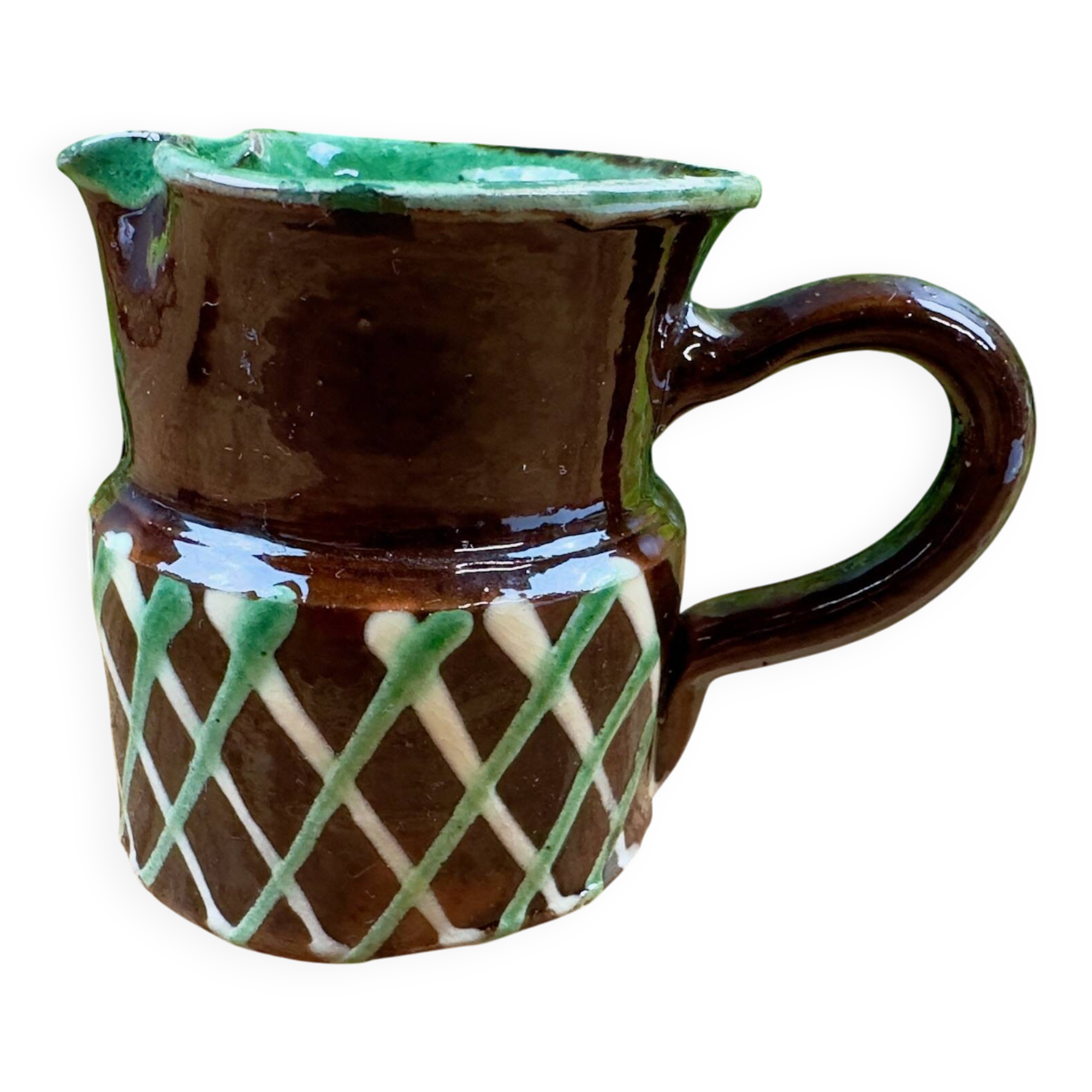 Small vintage ceramic jug in brown glazed with geometric design.
