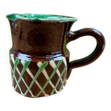 Small vintage ceramic jug in brown glazed with geometric design.