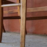 Set of 5 mismatched straw chairs.