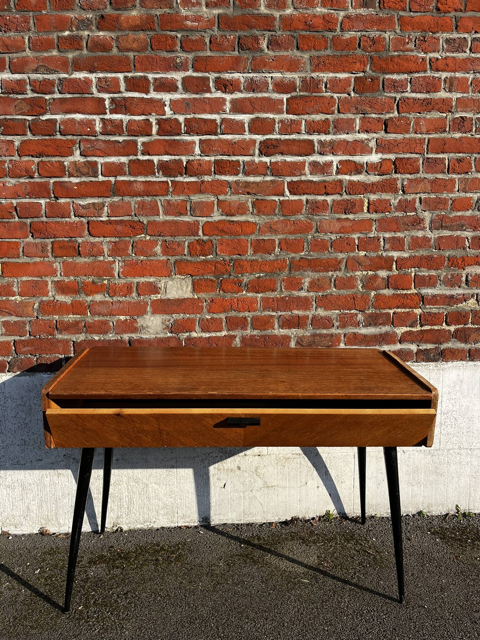 Vintage wooden console/desk with tapered legs.