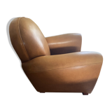 Brown leather club armchairs with an antique finish.