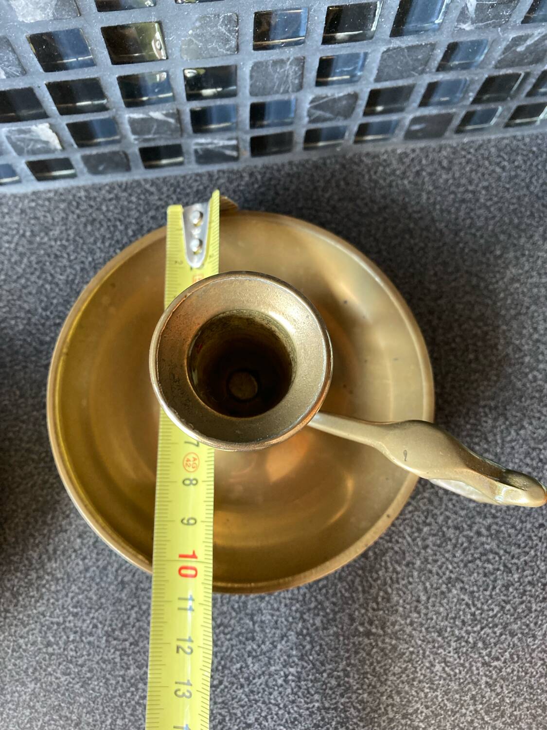 Two brass hand candle holders