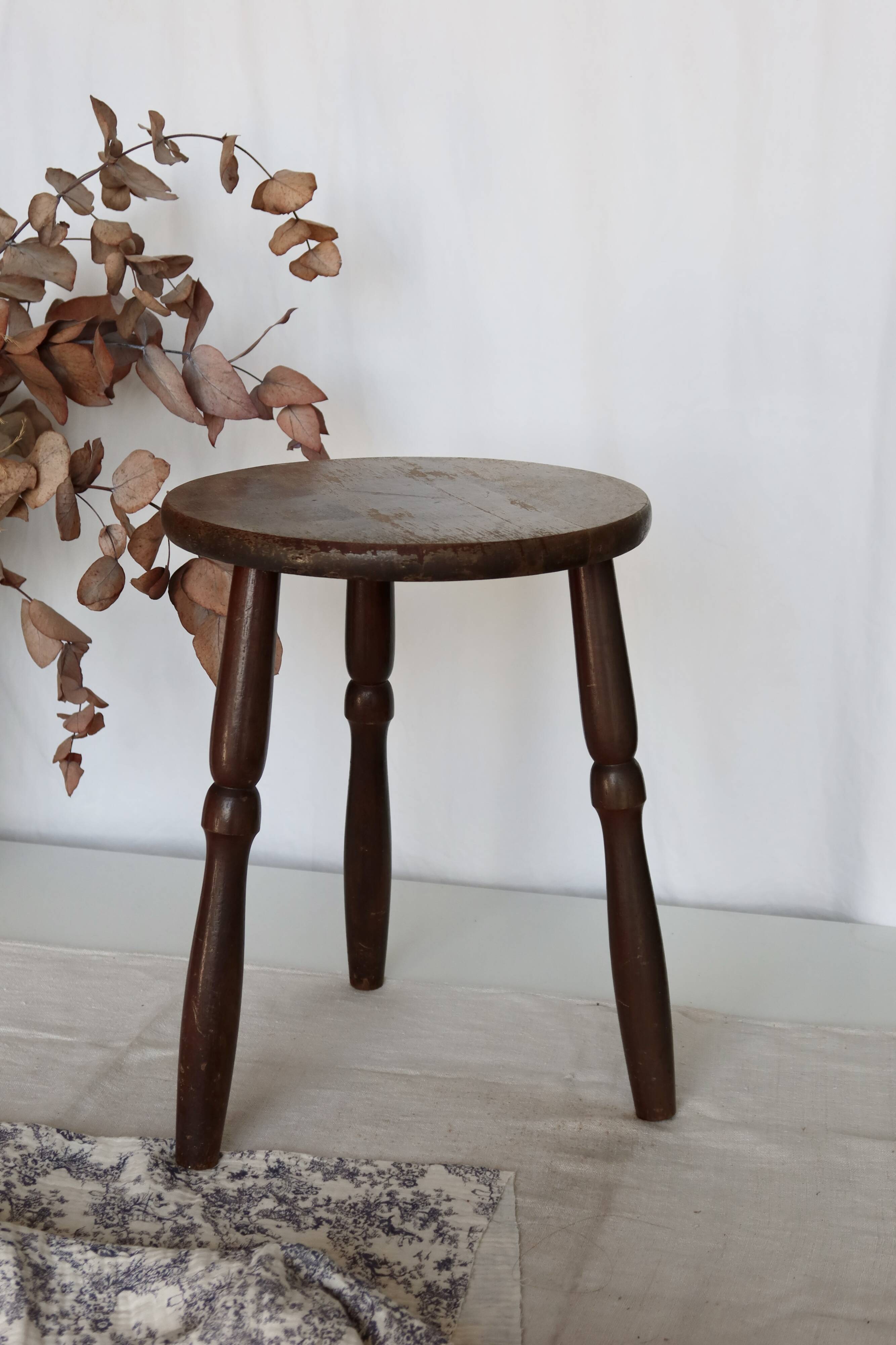 Antique tripod stool in turned wood