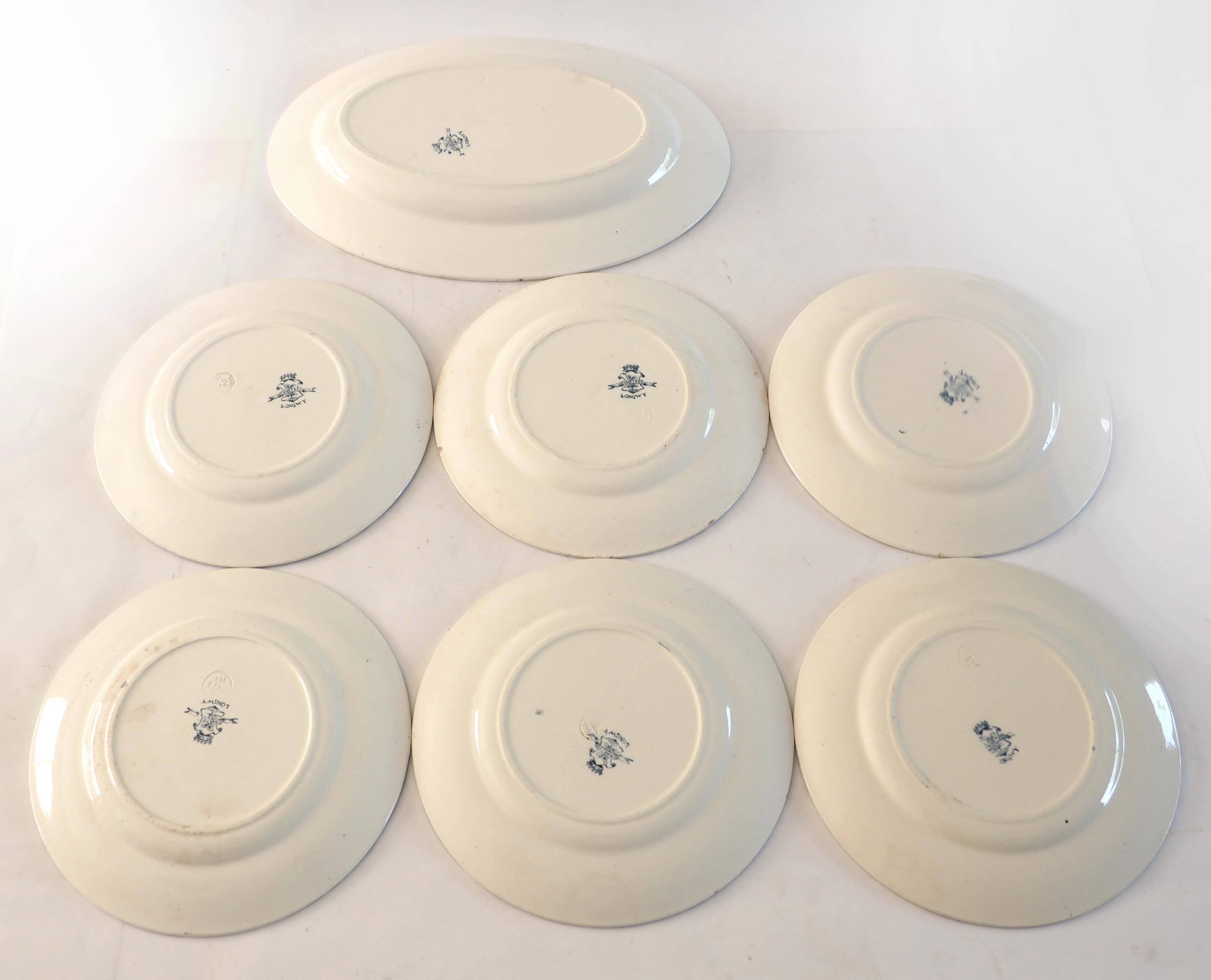 6 assiettes et 1 plat ovale en terre de fer