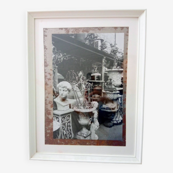 Framed black and white photograph of an antique dealer