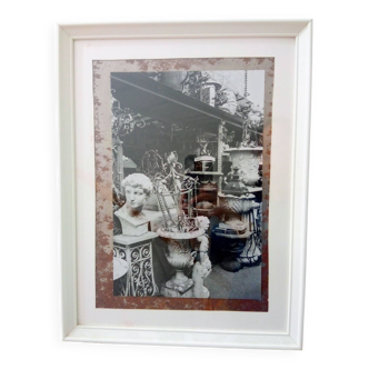 Framed black and white photograph of an antique dealer