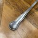 Christofle brand ladle in silver metal - Letter B on the back.
