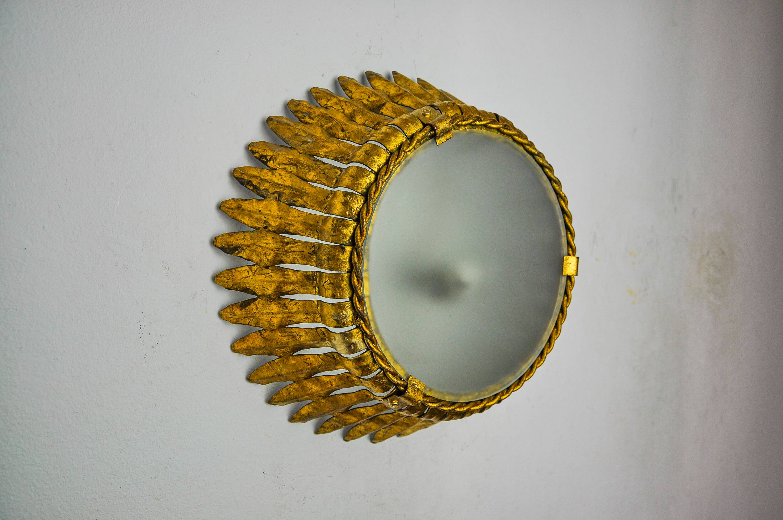 Sun wall lamp by ferro arte, metal and gold leaf, Spain, 1960