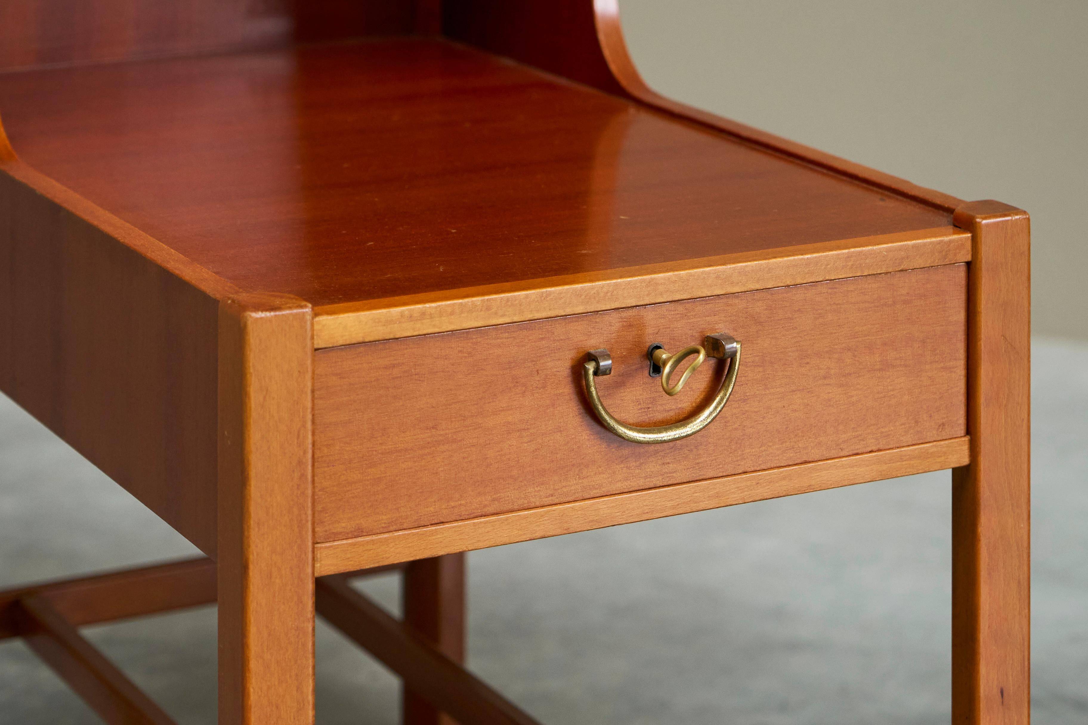 Pair of bedside tables by Nordiska Kompaniet in teak, 1952, by David Rosén.