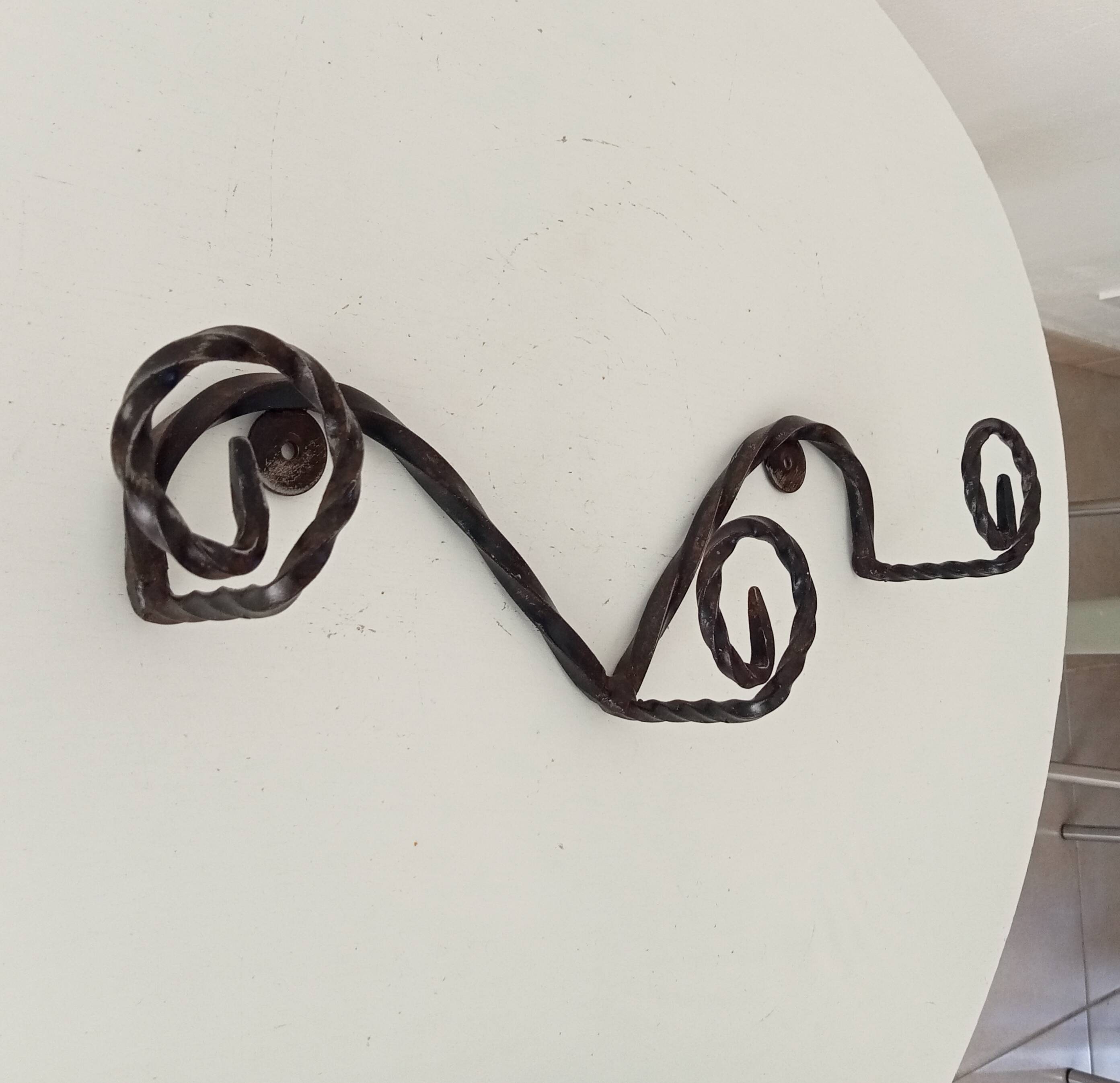 Vintage wrought iron wall coat rack