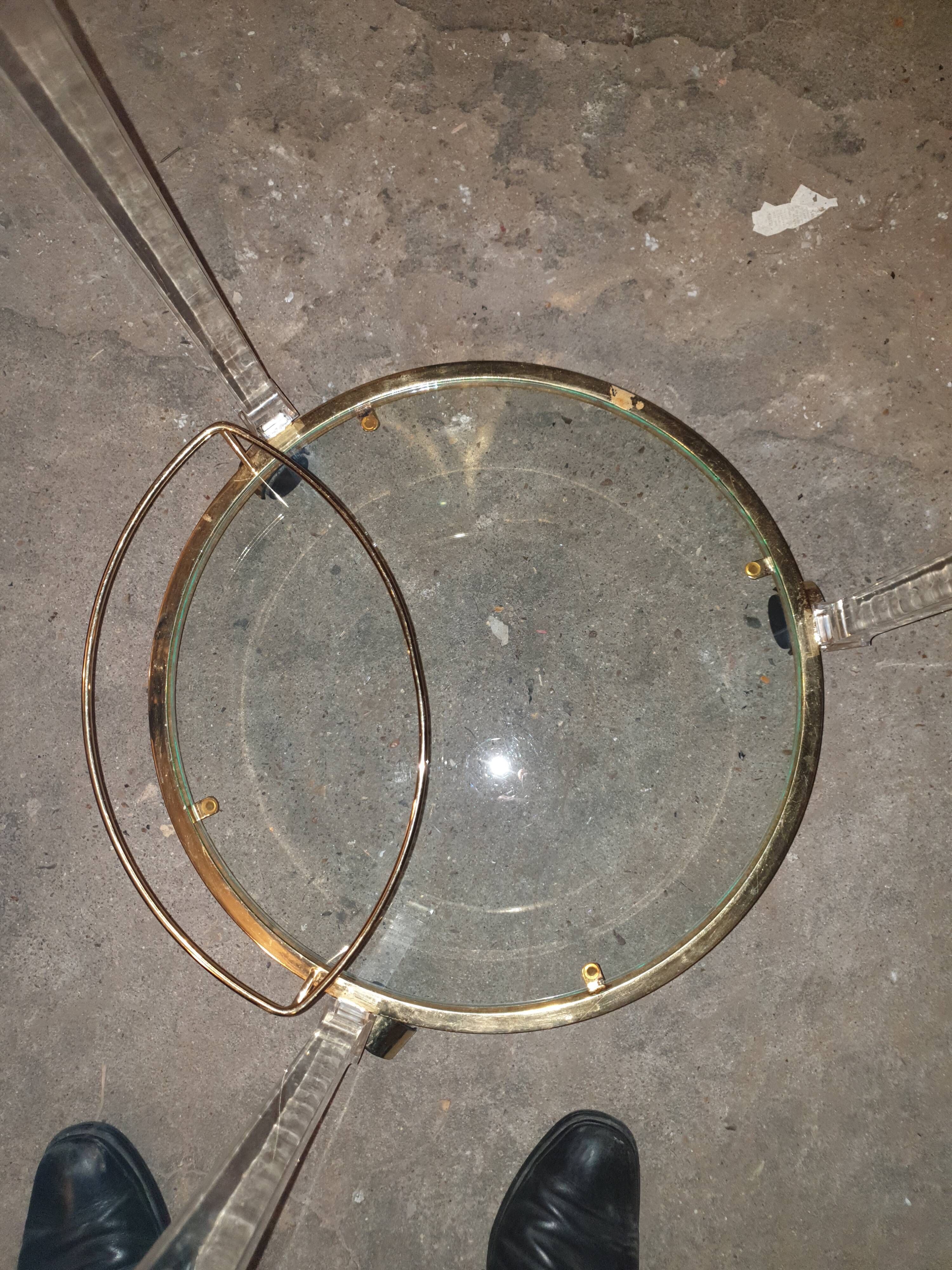 Round table in glass and brass and acrylic columns, 1980